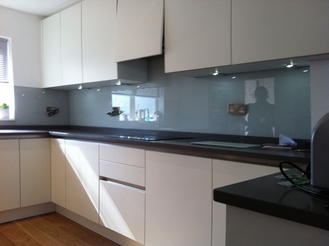 Grey glass kitchen splashback with LED lighting in Ealing