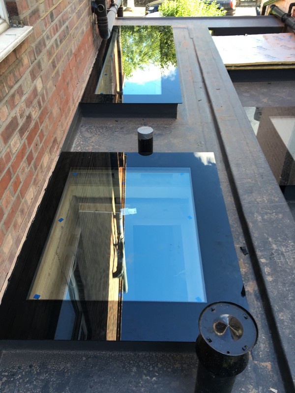 Multiple flat roof skylights on extension in Ealing